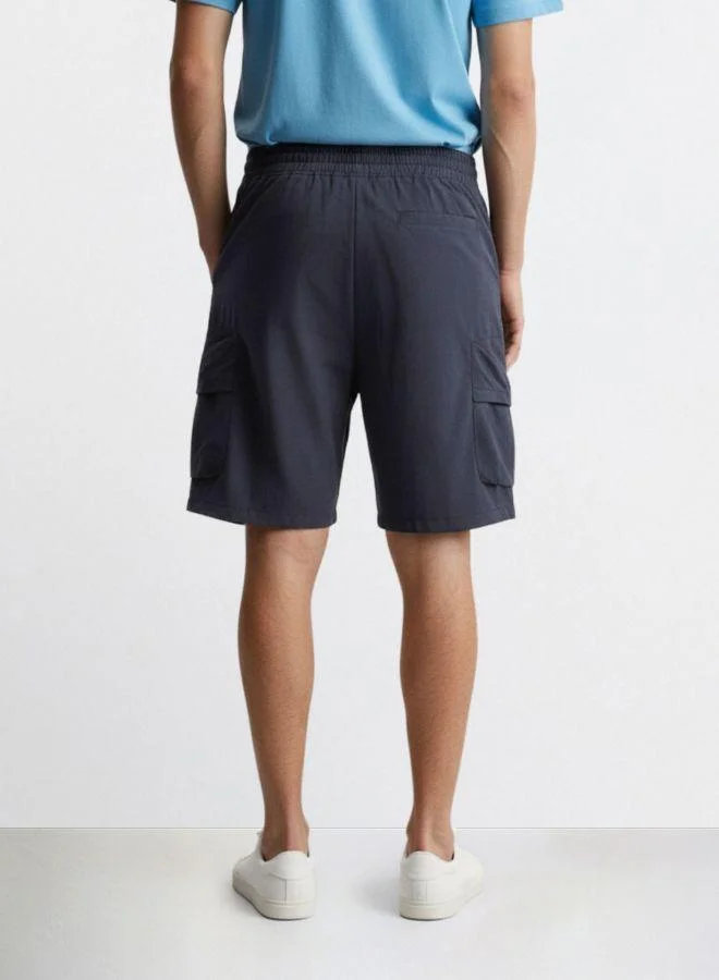 The Indian Garage Co Men Relaxed Fit Solid Cargo Pocket Mid-Rise Cargo Shorts